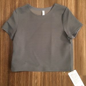 Lululemon top. Size 6. Shaped SS. New with tags.